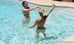 Blonde and Brunette Babes having fun with camera in the water