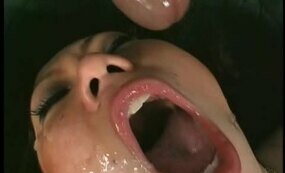 Asian babe gets facial from two cocks