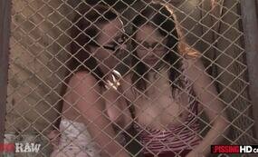Pissing girls behind bars